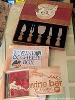 Closed lot displaying knife set box, book, CD with sleeve