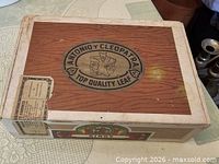 Top view showing Antonio y Cleopatra logo and overall box condition