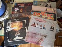 Stack of LPs showing several album covers