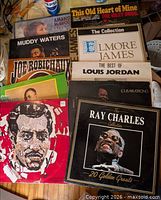 Front view showing majority of album covers laid out