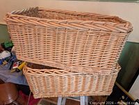 Two stacked rectangular rattan baskets showing overall design and weave