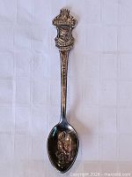 Full view of spoon front showing crest and bowl