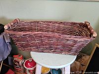 Top angled view of rectangular willow basket showing weave and color