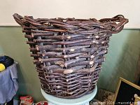 Side view showing overall basket shape and twig weave