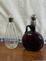 Both bottles side by side on table