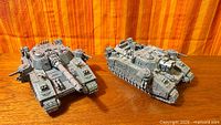 Both assembled tanks side by side showing relative size and completion state