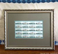 Front view of framed stamp block showing full piece and matting