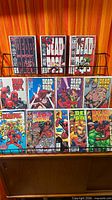 Rack displaying 12 Deadpool comic books