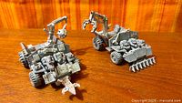 Both assembled Ork Trukks side by side