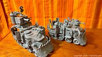 Both assembled unpainted Ork Battlewagons side by side