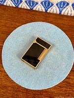 Front of black lacquer S.T. Dupont lighter