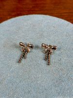 Front view of both bow dangle earrings