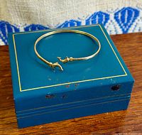 bangle displayed on closed blue box