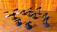 Group of ten Dark Eldar pewter starships on flight bases