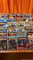 Front view of first half of Warhammer 40,000 comics, bagged and boarded on rack