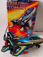 Jet airplane displayed in front of original box