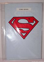 Front view of sealed The Adventures of Superman #500 polybag showing Superman shield logo