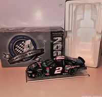 Box, styrofoam insert, and die-cast #2 Miller Lite stock car on display base