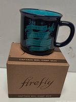 Firefly Captain Mal camp mug on top of its original box