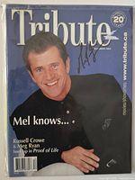 Front cover showing Mel Gibson portrait, Tribute masthead, autograph in black ink