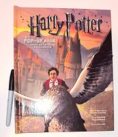 Front cover of Harry Potter pop-up book with marker for scale