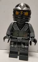 Front view of LEGO Ninjago Cole digital alarm clock showing LCD screen and character details
