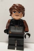 Front view of LEGO Anakin Skywalker alarm clock showing LCD display and figure details