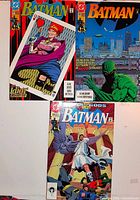 Front view showing all three Batman comic book covers