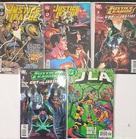 Front view of five bagged Justice League single-issue comic books