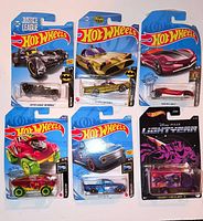 Front view of six sealed Hot Wheels cars on cards arranged in two rows
