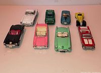 Eight diecast cars arranged in two rows showing front and side details
