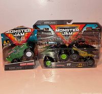 Front view of both sealed Monster Jam packages showing vehicles and branding