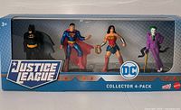 Front view of sealed Justice League 4-Pack showing Batman, Superman, Wonder Woman, Joker figures in window box