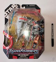 Front view of sealed Transformers Crossovers Star Wars Luke Skywalker Snowspeeder package