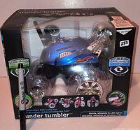 Front view of sealed retail box showing Blue Hat Thunder Tumbler RC vehicle