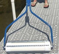 Weed roller on dock showing assembled frame and drum