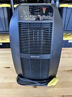 Front view of Honeywell heater showing grille, logo, controls