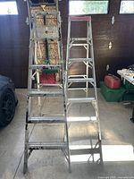 Front view of both aluminum step ladders