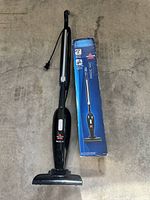 Used Magic Vac standing beside boxed new unit