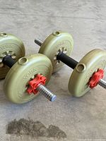 Pair of assembled York adjustable dumbbells