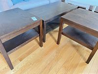 Entire three-piece table set showing coffee table and two end tables