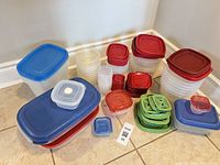 group of assorted plastic containers with lids stacked