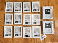 All 14 frames laid out: 12 IKEA FISKBO on left, 2 Sears frames boxed on right
