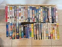 All 48 VHS tapes aligned spine-out on floor