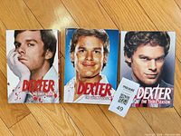 Front view of three Dexter DVD box sets Seasons 1-3