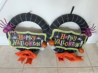 Both matching Halloween wreaths side by side