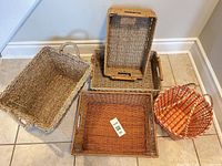 Overview of five baskets on tiled floor