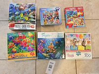 All six sealed puzzle boxes laid out for overview