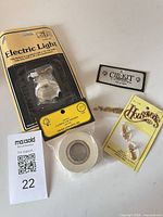 Overall shot showing all five packaged miniature lighting components and tape supplies