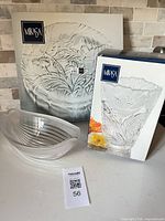 Serving bowl displayed with boxed vase and boxed platter behind